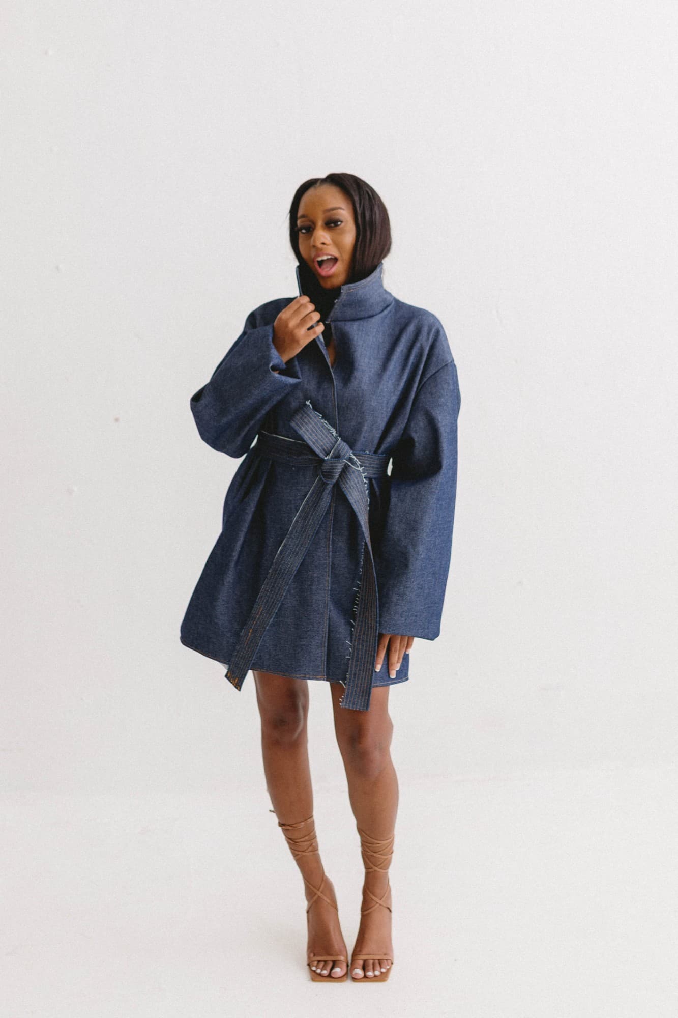 the first impression, belted with high collar